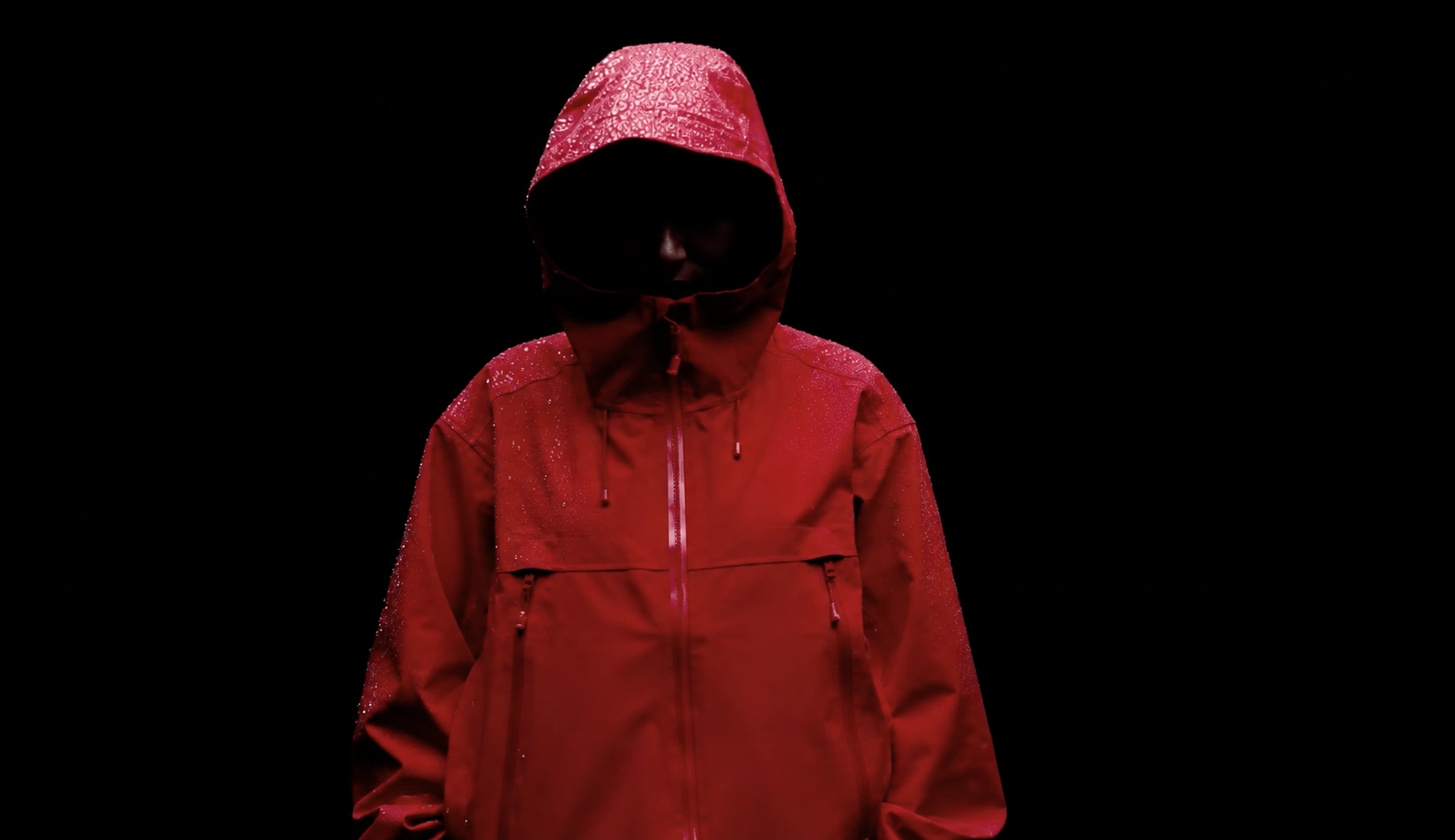 Red outdoor jacket in rain